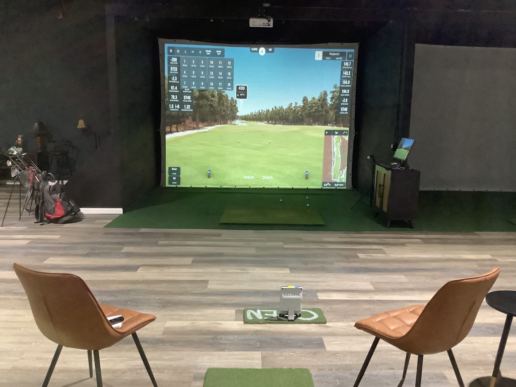 Full Swing simulator bay and seating at Mashie Golf Institute in Myrtle Beach