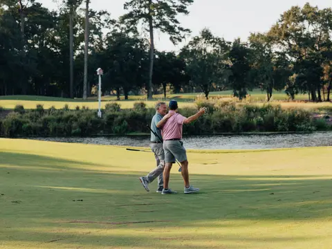 Myrtle Beach 27 hole courses package with two golfers walking off a green