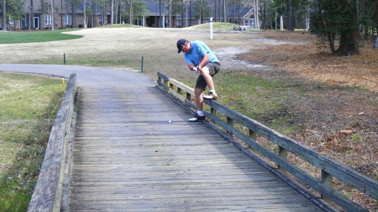 Golfer swinging on cart path at Myrtle Beach